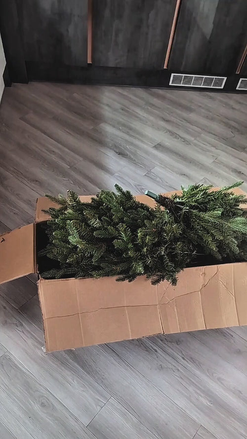 How Tree Slims compress an artificial Christmas tree so it fits back in its box